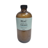 Bottle of Mint Floor Wash with a label on a white background
