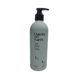 Bottle of 'Guests on Earth' dish soap with pump on a white background